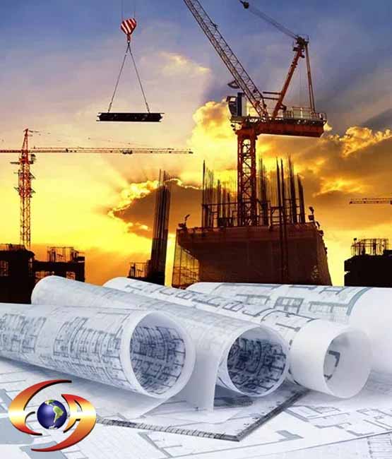Obra en construcción con grúas y planos de ingeniería